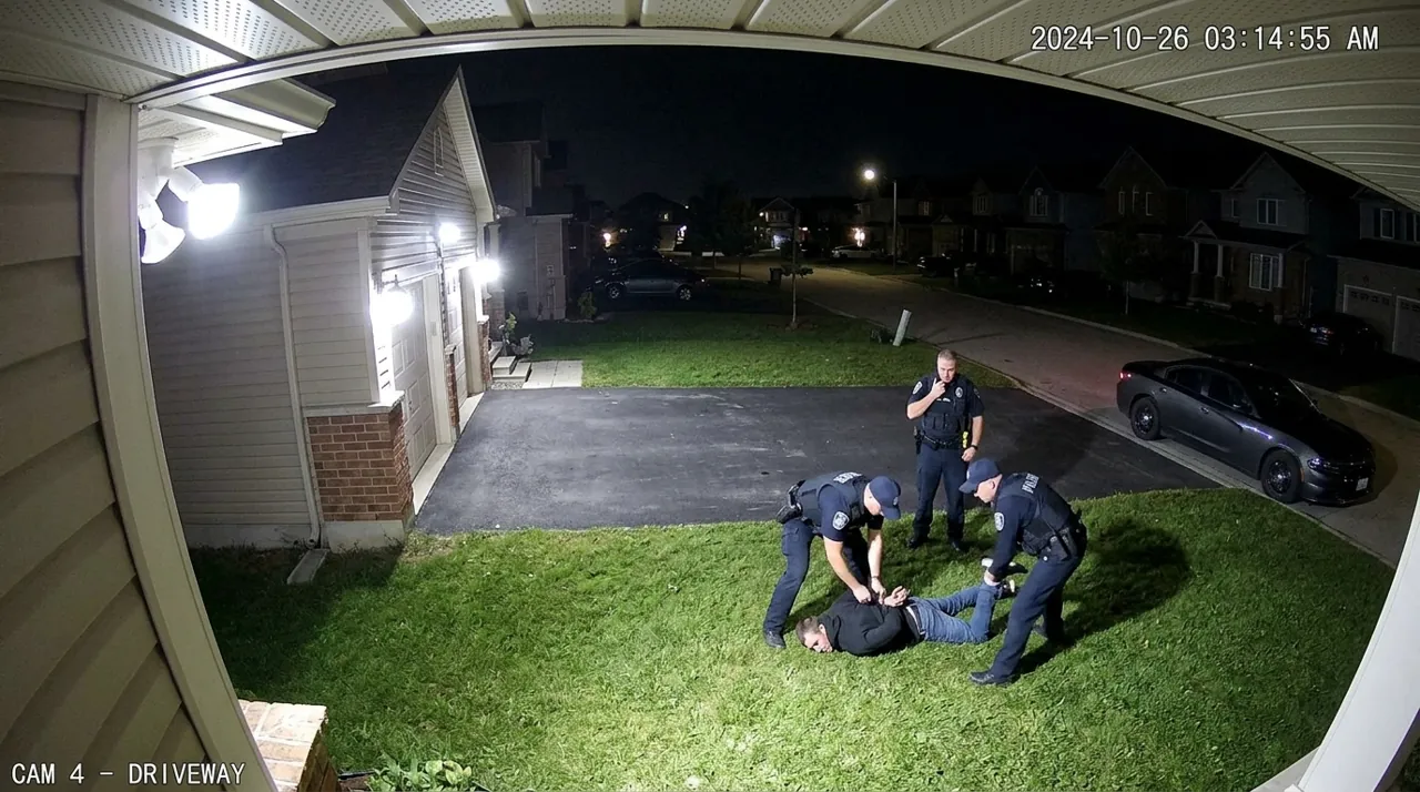 Police apprehending a suspect on a lawn
